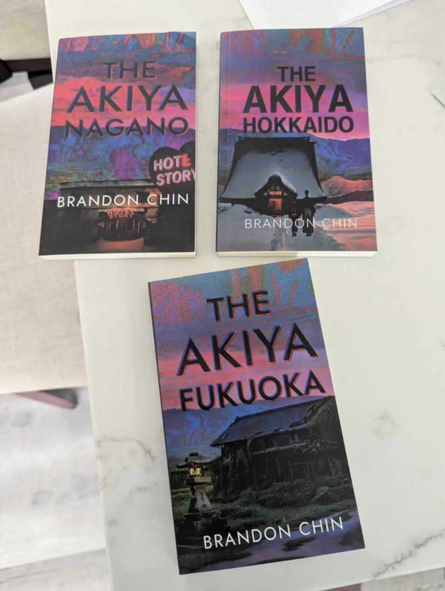The Fukuoka, Hokkaido, and Nagano paperbacks photographed together